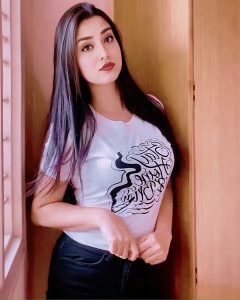 Elegant lady in white top posing for Dhaka escort agency